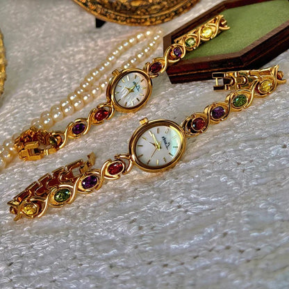 Ladies watch with gemstones and oval dial