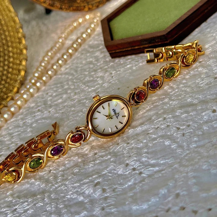 Ladies watch with gemstones and oval dial