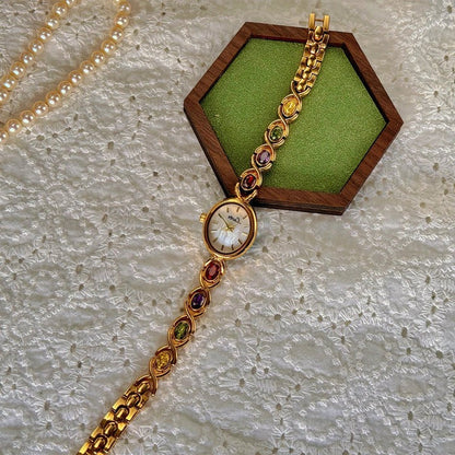 Ladies watch with gemstones and oval dial