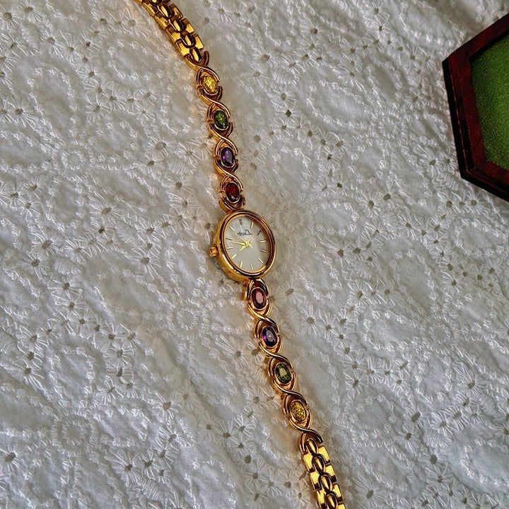 Ladies watch with gemstones and oval dial